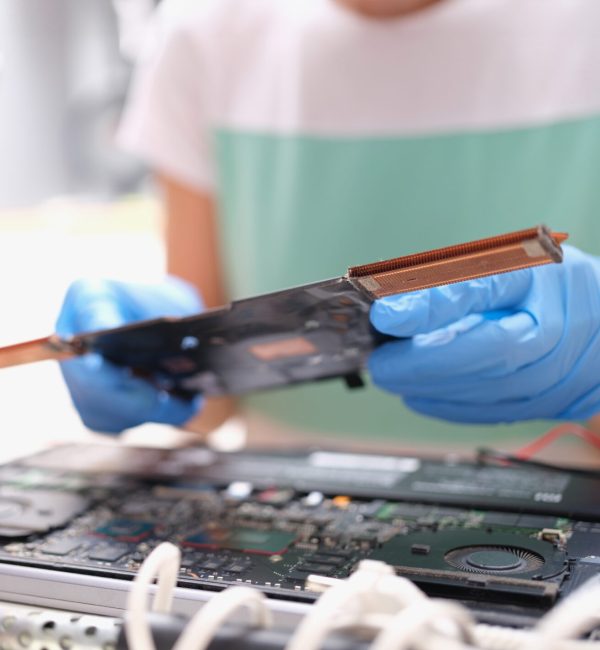 Technical engineer is working on computer motherboard. Repair of computer equipment concept